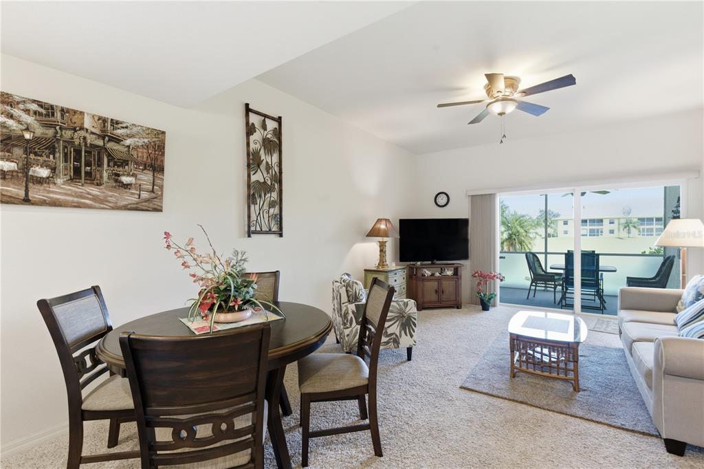 1246 Rio De Janeiro Avenue, Unit 503 Punta Gorda, FL 33983 - Photo 12 of 34 a living room with furniture and a flat screen tv