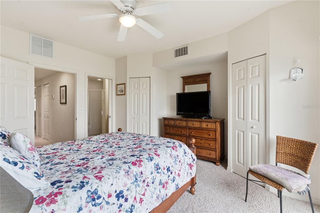 1246 Rio De Janeiro Avenue, Unit 503 Punta Gorda, FL 33983 - Photo 16 of 34 a bedroom with a bed and a flat screen tv in it