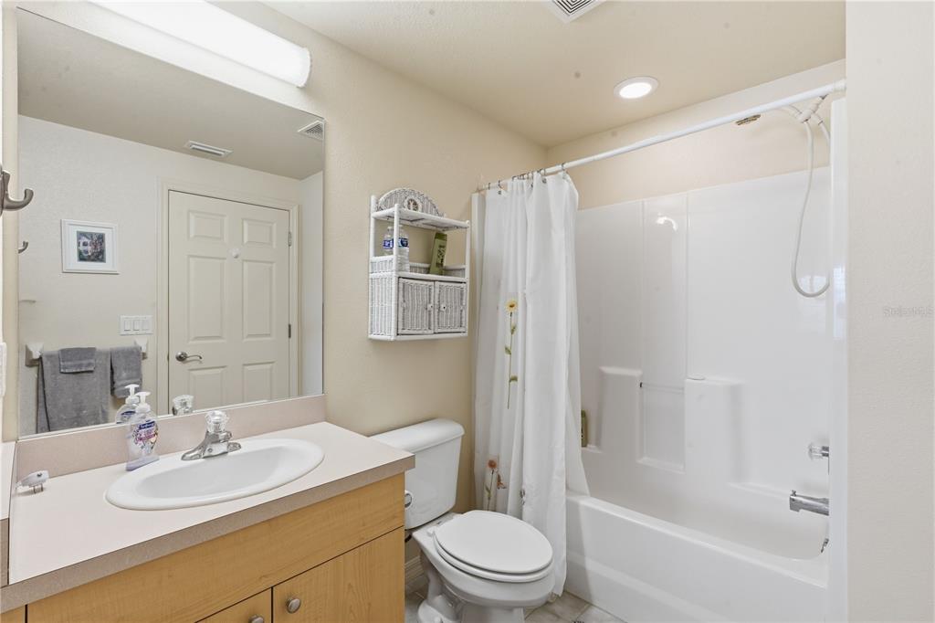 1246 Rio De Janeiro Avenue, Unit 503 Punta Gorda, FL 33983 - Photo 20 of 34 a bathroom with a sink toilet and shower