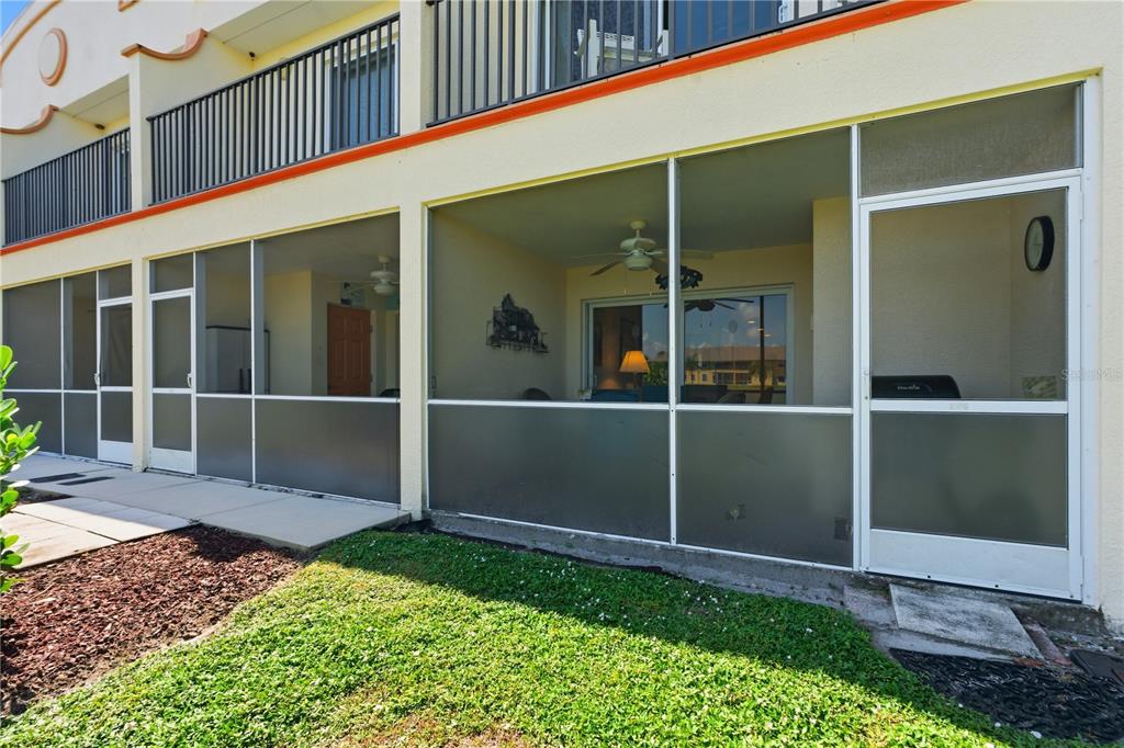 1246 Rio De Janeiro Avenue, Unit 503 Punta Gorda, FL 33983 - Photo 24 of 34 a view of front door and yard