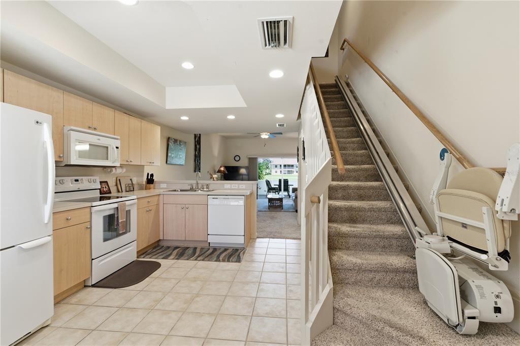 1246 Rio De Janeiro Avenue, Unit 503 Punta Gorda, FL 33983 - Photo 3 of 34 a kitchen with white cabinets and appliances