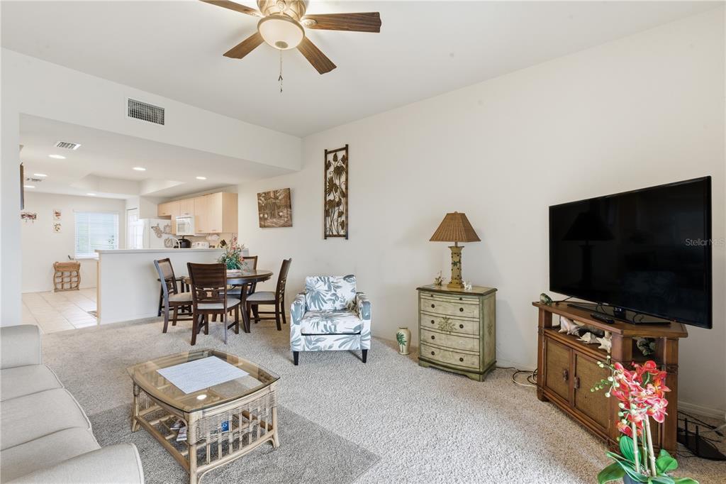 1246 Rio De Janeiro Avenue, Unit 503 Punta Gorda, FL 33983 - Photo 7 of 34 a living room with furniture and a flat screen tv