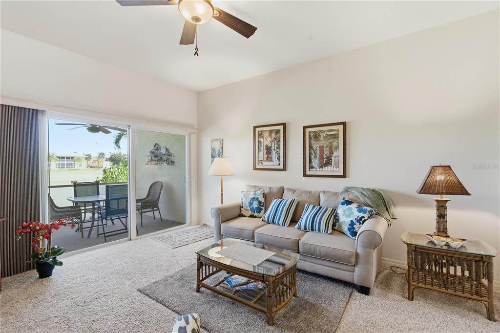 1246 Rio De Janeiro Avenue, Unit 503 Punta Gorda, FL 33983 - Photo 9 of 34 a living room with furniture and a flat screen tv