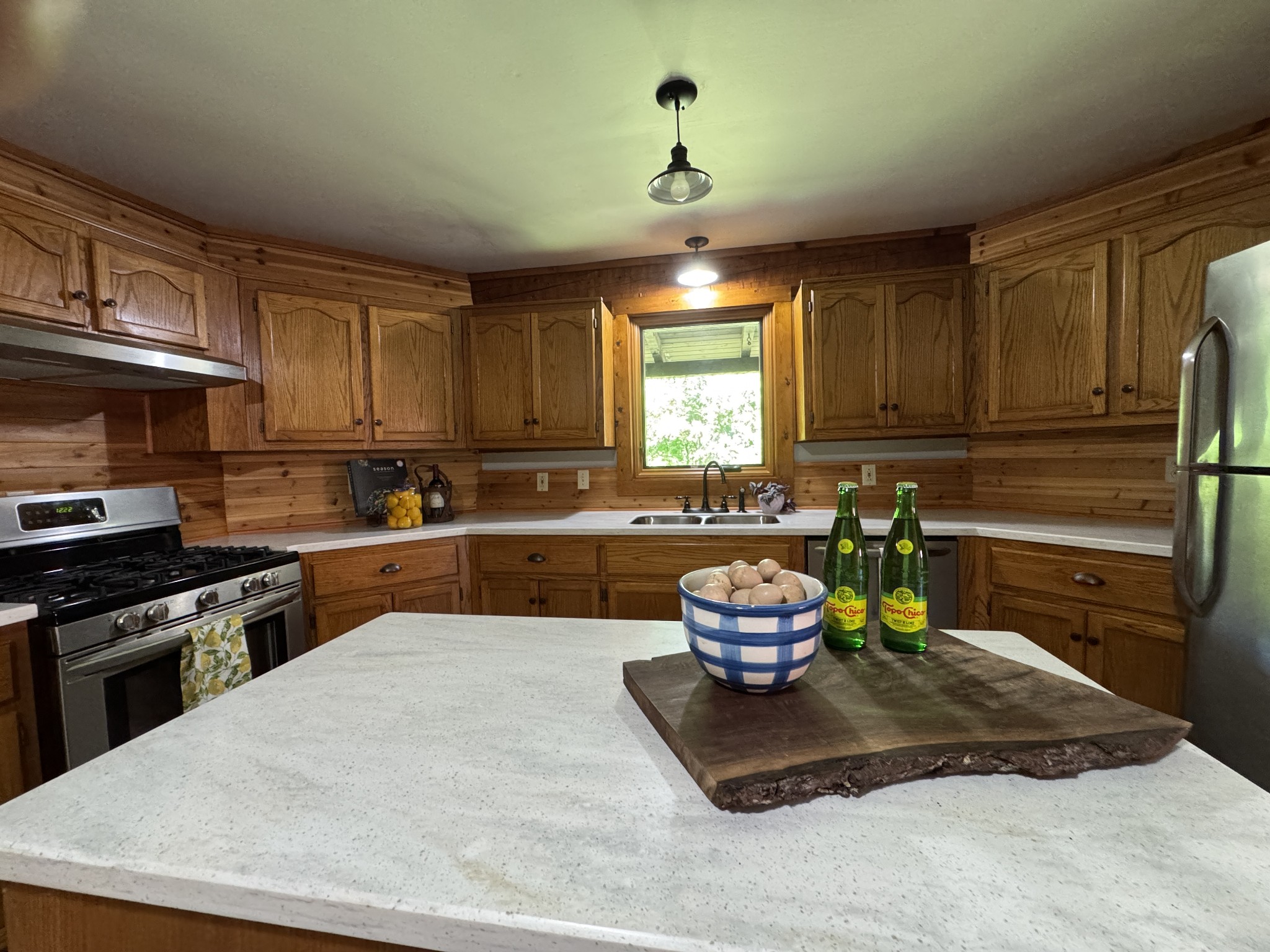 1342 Aetna Church Road Centerville, TN 37033 - Photo 37 of 59 a kitchen with a stove a sink and cabinets