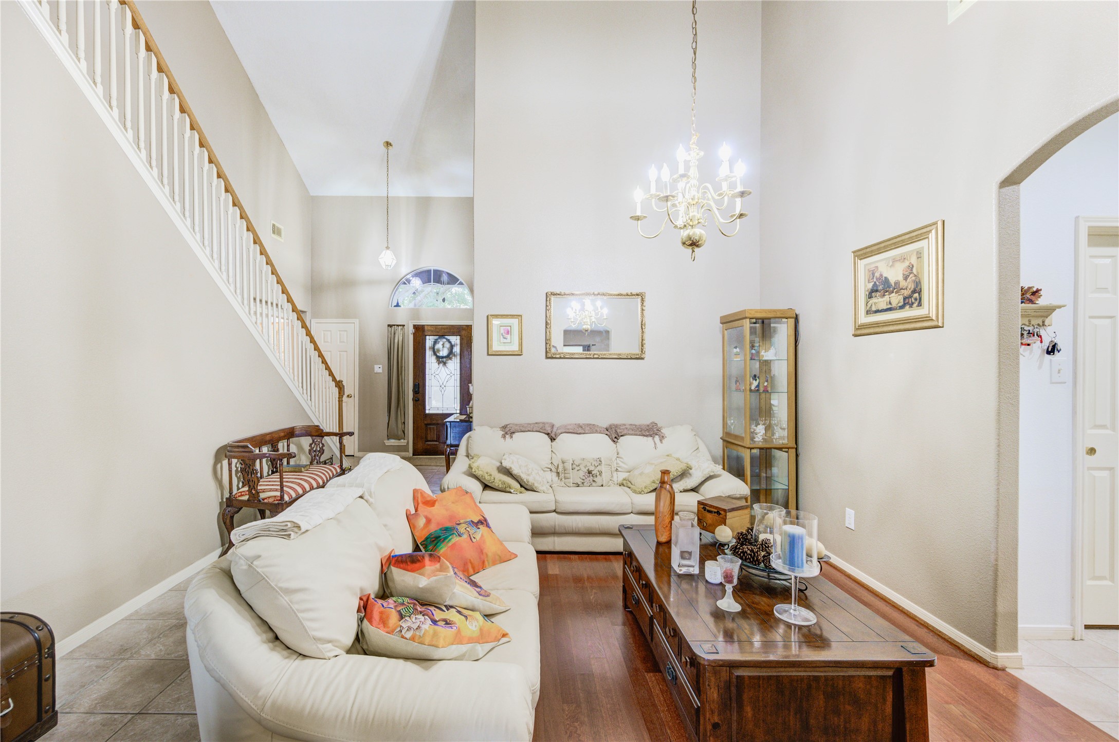 16730 Spring Barker Drive Cypress, TX 77429 - Photo 18 of 50 a living room with furniture and a chandelier