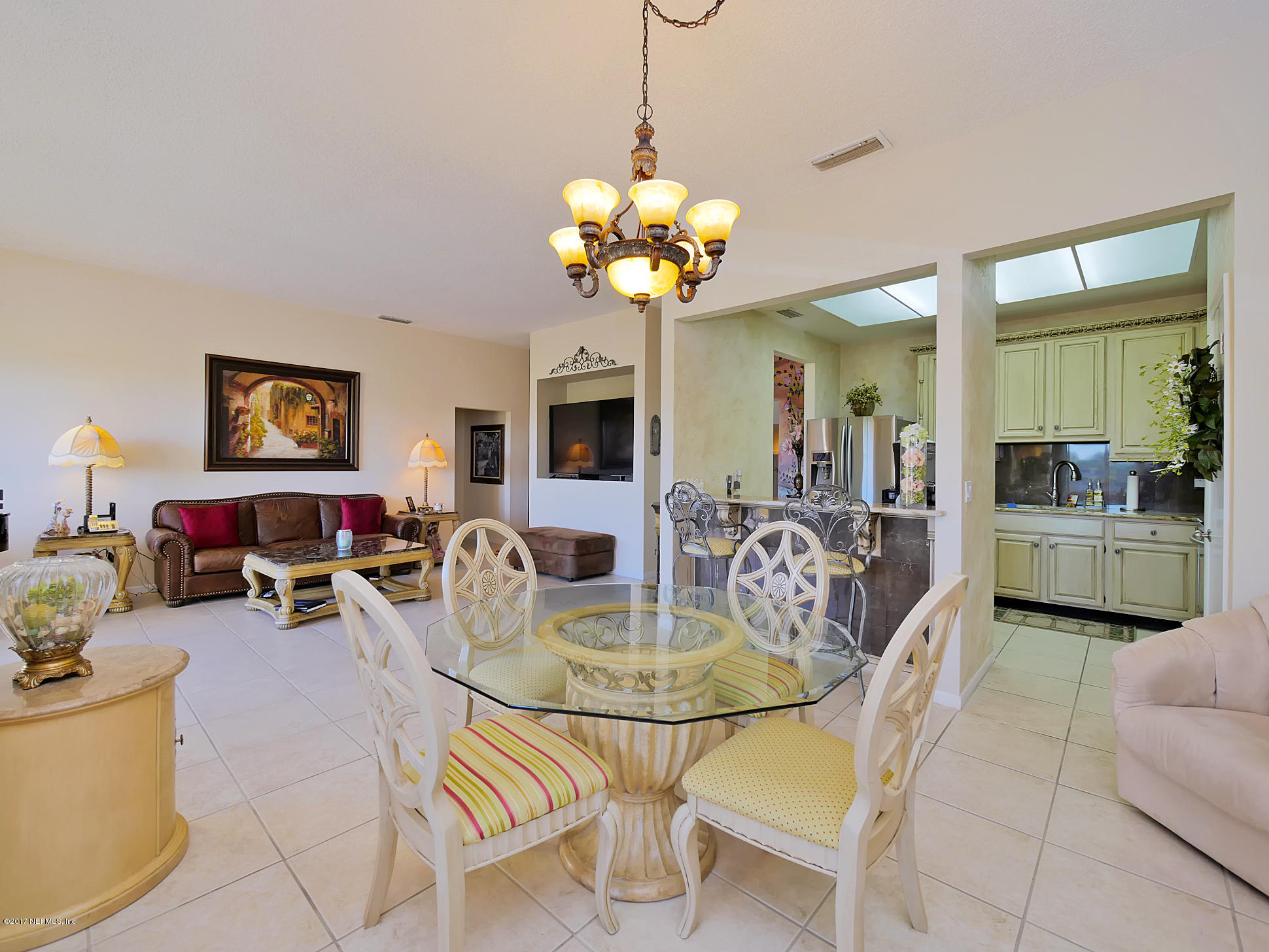 2 Cove Road Ponte Vedra Beach, FL 32082 - Photo 16 of 28 a view of a dining room with furniture and a chandelier