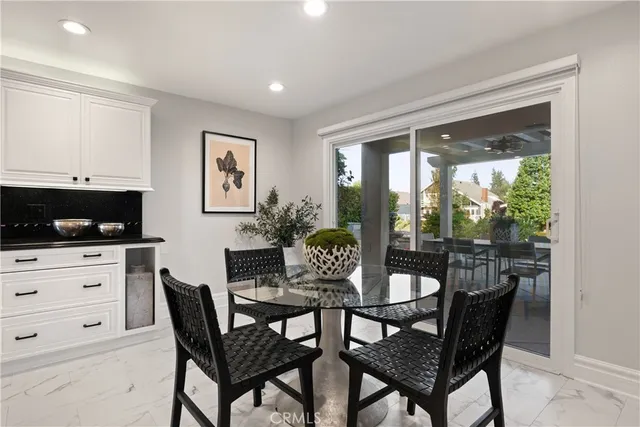 a kitchen with stainless steel appliances kitchen island granite countertop a sink and cabinets