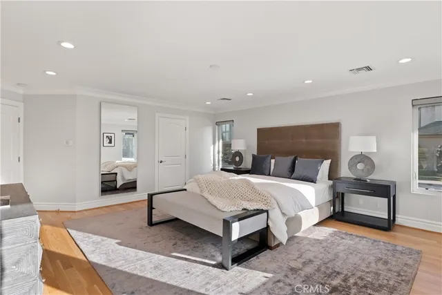 a view of a patio with a table and chairs and potted plants