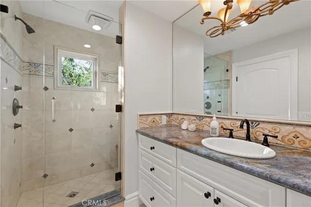 a view of a lake with a table and chairs