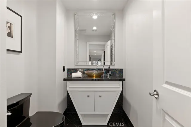 a spacious bedroom with a bed and a large window