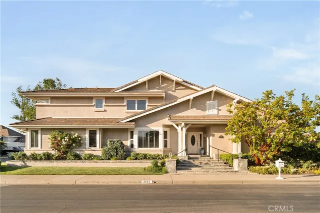 a bathroom with a granite countertop tub sink and mirror