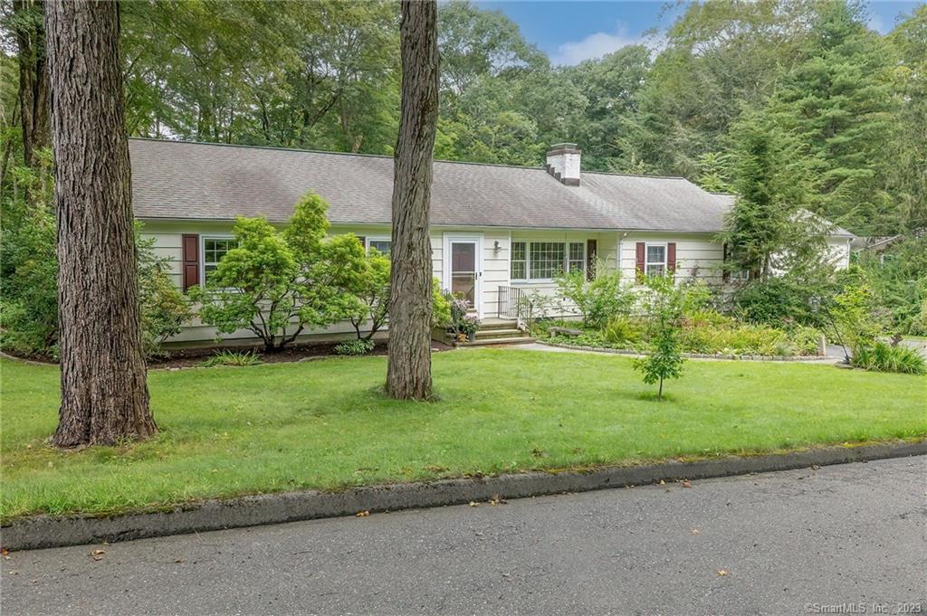 16 Kiahs Brook Lane Ridgefield, CT 06877 - Photo 1 of 1 a front view of a house with garden