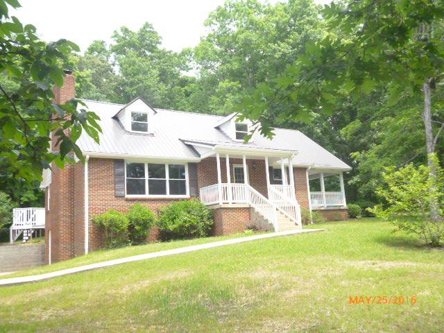 450 West Piney Road Dickson, TN 37055 - Photo 2 of 29 a view of a house with backyard and garden