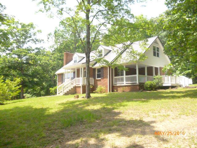 450 West Piney Road Dickson, TN 37055 - Photo 27 of 29 a view of a house with a big yard and large trees