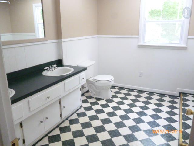 450 West Piney Road Dickson, TN 37055 - Photo 28 of 29 a bathroom with a granite countertop sink and a toilet