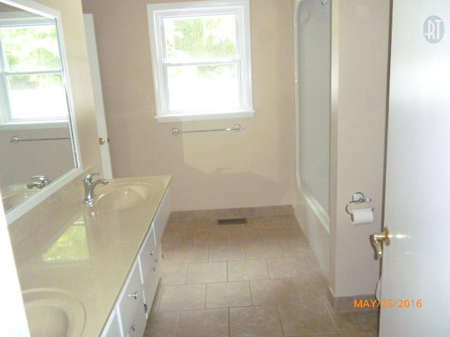 450 West Piney Road Dickson, TN 37055 - Photo 29 of 29 a bathroom with a tub and shower