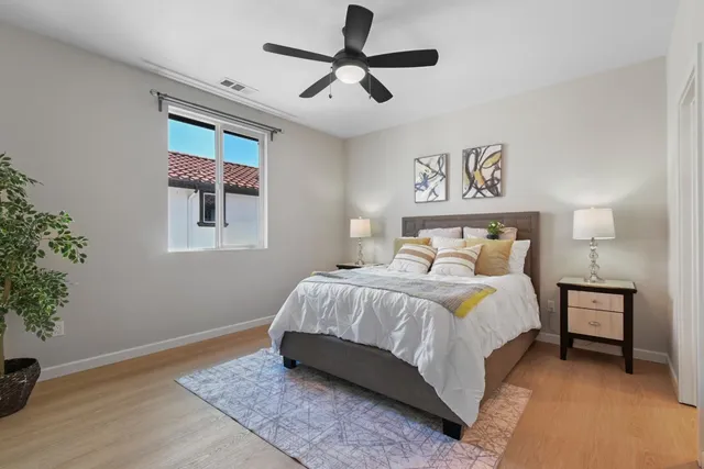 a bedroom with a bed and a window