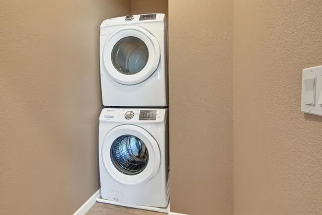 a close up view of a washer and dryer in a utility room
