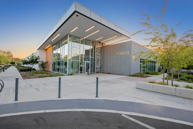 a picture of a bench in front of a gate