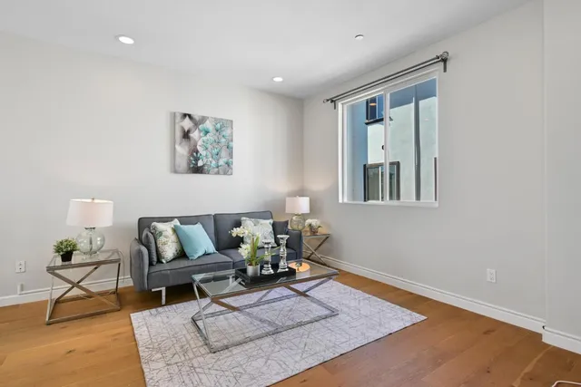 a living room with furniture and a rug