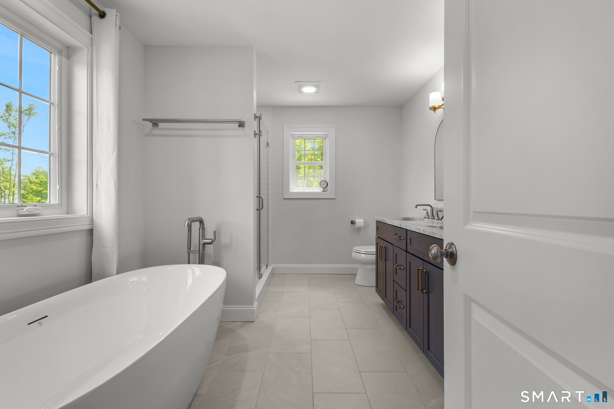 2 Martys Way Gales Ferry, CT 06335 - Photo 22 of 40 a bathroom with a tub sink and mirror