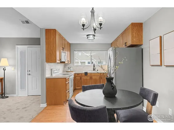 a kitchen with a table and chairs