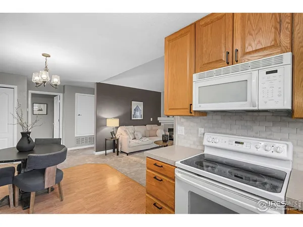 a kitchen with a stove a sink and a microwave