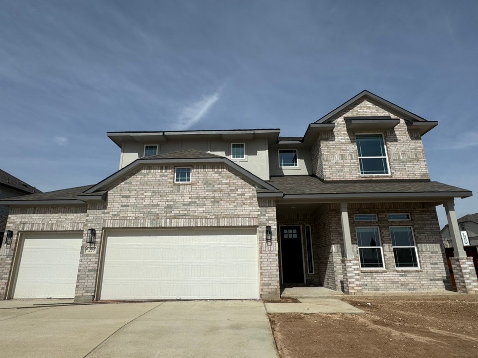 277 Oak Blossom Road Liberty Hill, TX 78642 - Photo 1 of 1 a front view of a house with a yard