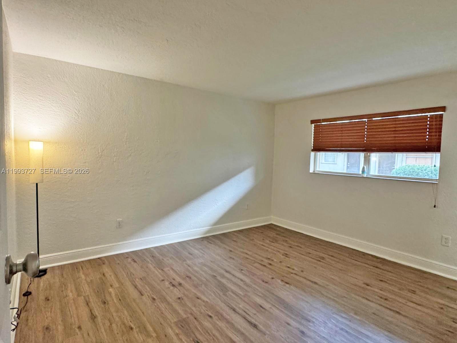 8475 Southwest 94th Street, Unit 119E Miami, FL 33156 - Photo 5 of 15 wooden floor in a room