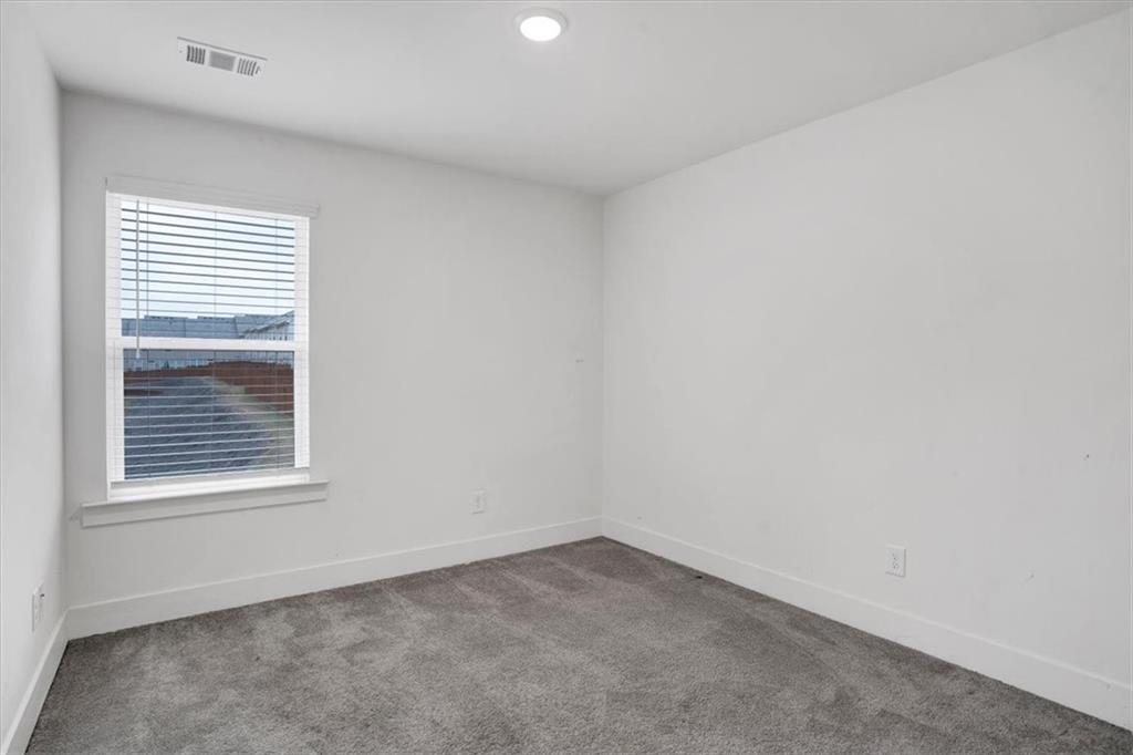 7788 Baron Road Fairburn, GA 30213 - Photo 14 of 17 a view of an empty room with a window