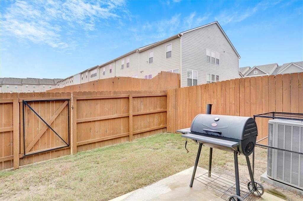 7788 Baron Road Fairburn, GA 30213 - Photo 15 of 17 a view of a backyard