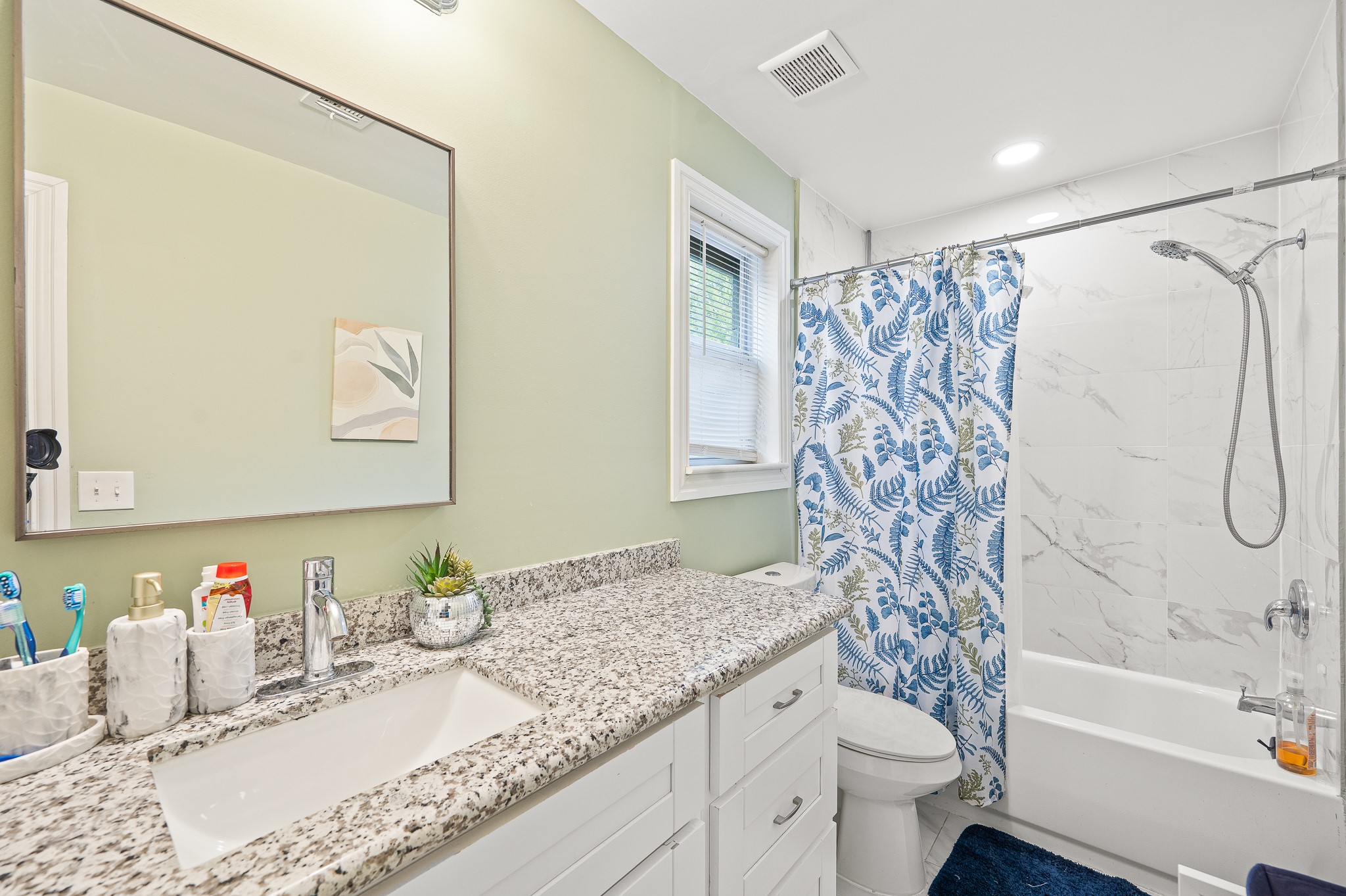 3823 Shadow Trail Houston, TX 77084 - Photo 14 of 29 a bathroom with a granite countertop sink and a mirror