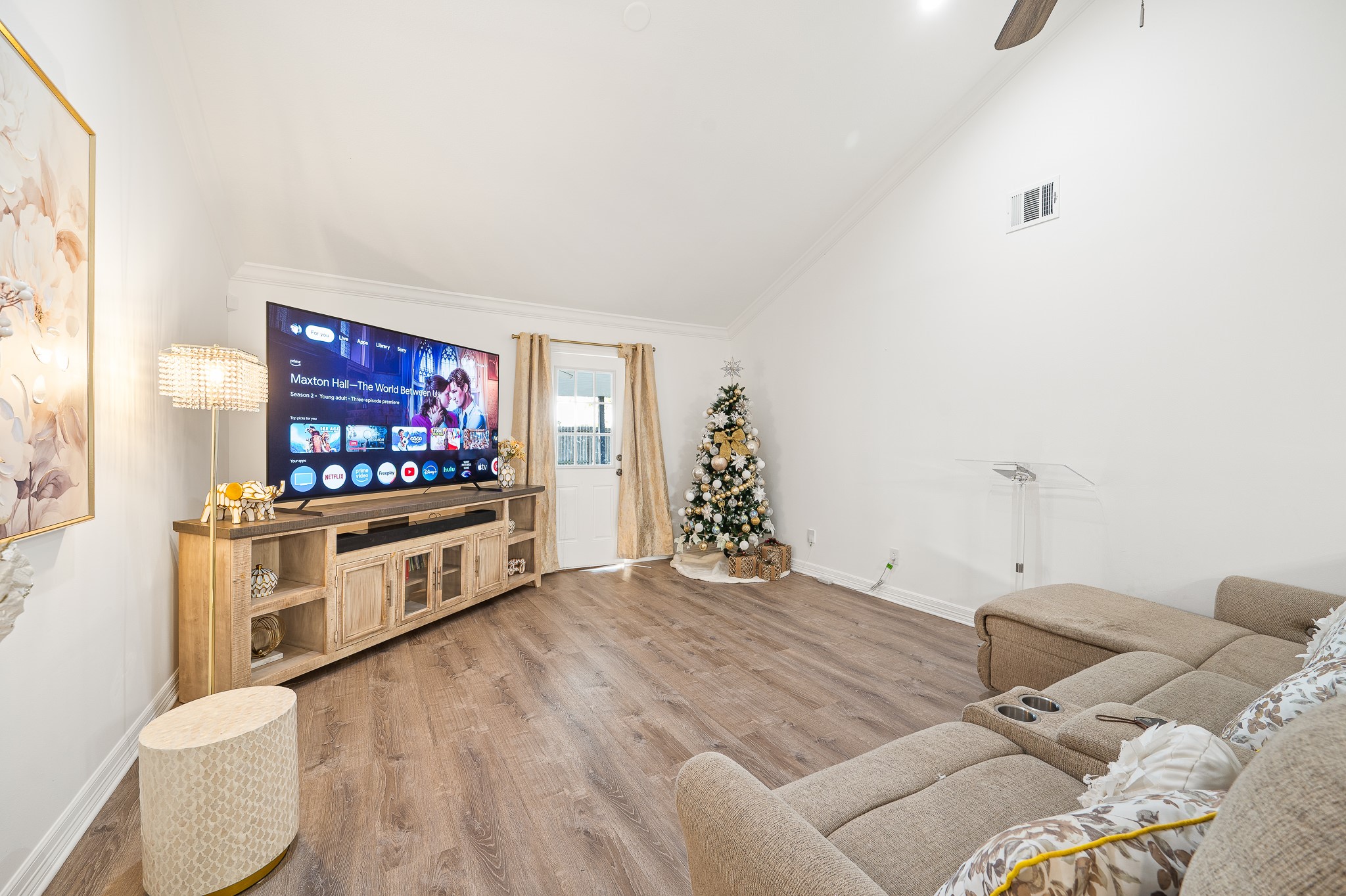 3823 Shadow Trail Houston, TX 77084 - Photo 16 of 29 a living room with a bed furniture and a flat screen tv
