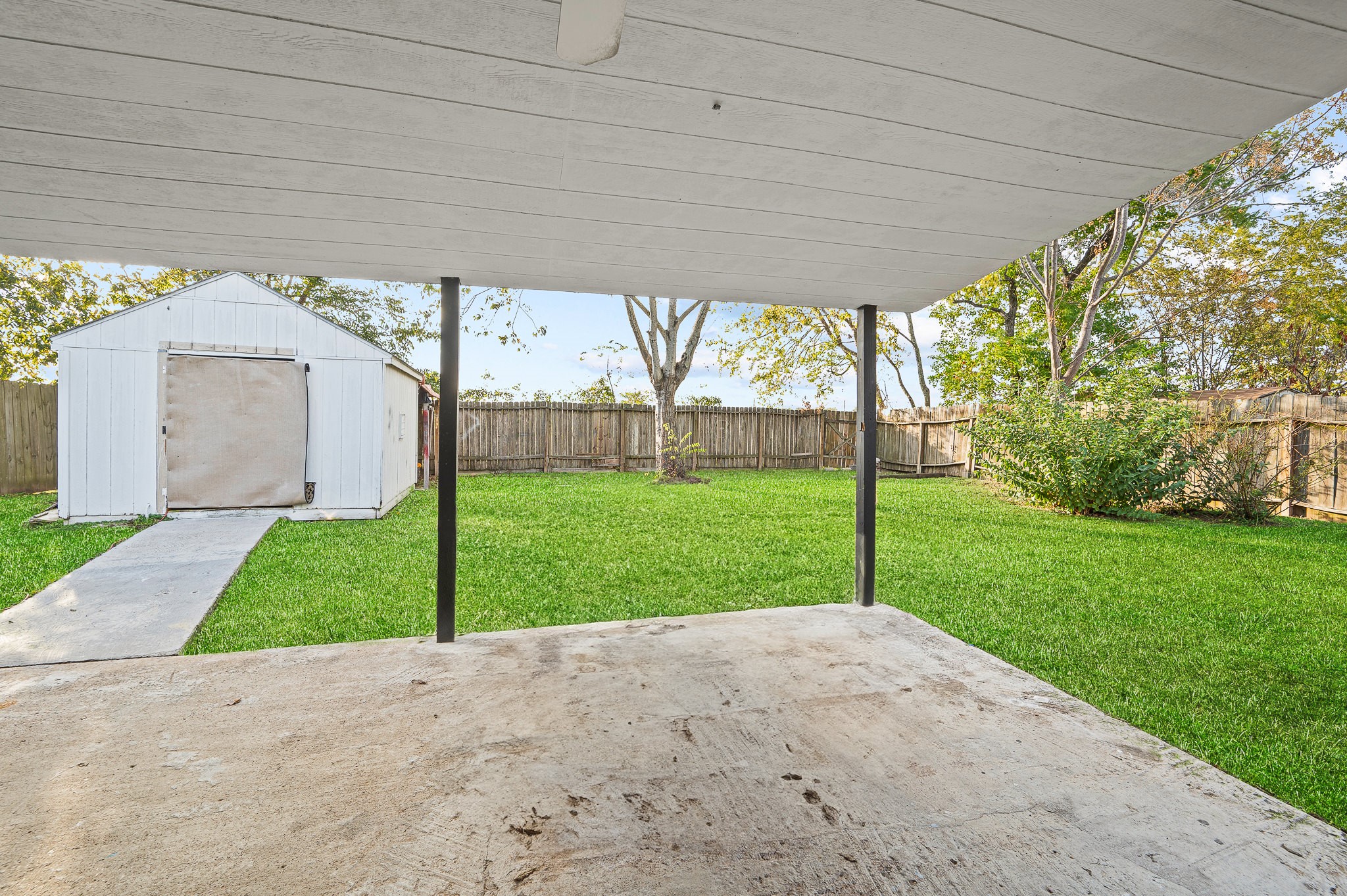 3823 Shadow Trail Houston, TX 77084 - Photo 26 of 29 a view of a house with backyard and a garden