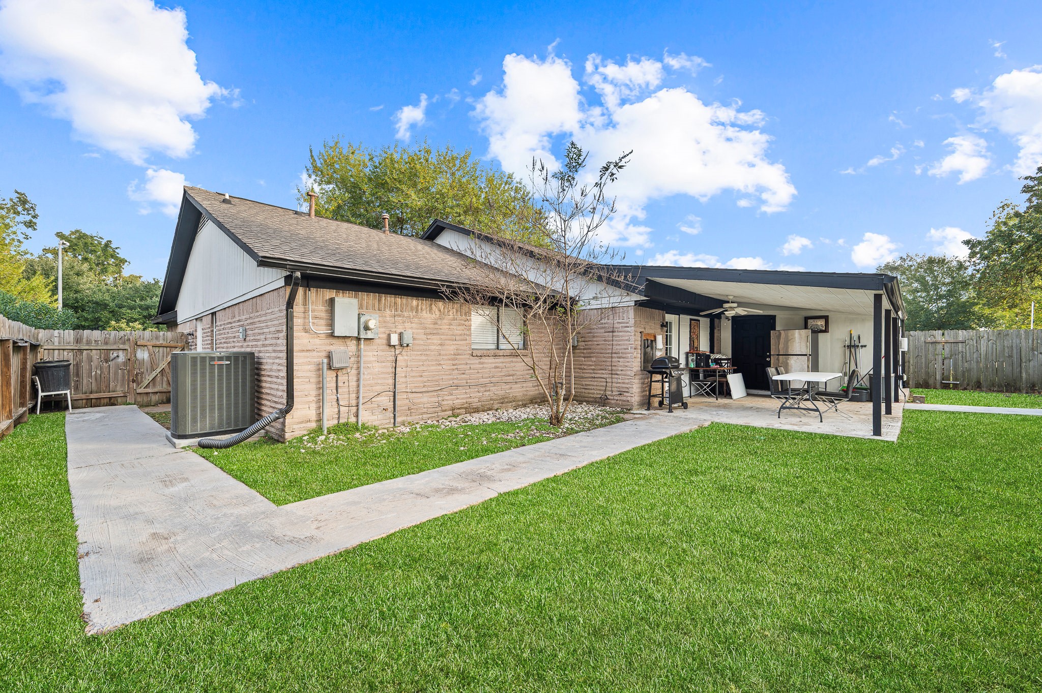 3823 Shadow Trail Houston, TX 77084 - Photo 29 of 29 a view of a house with backyard porch and sitting area