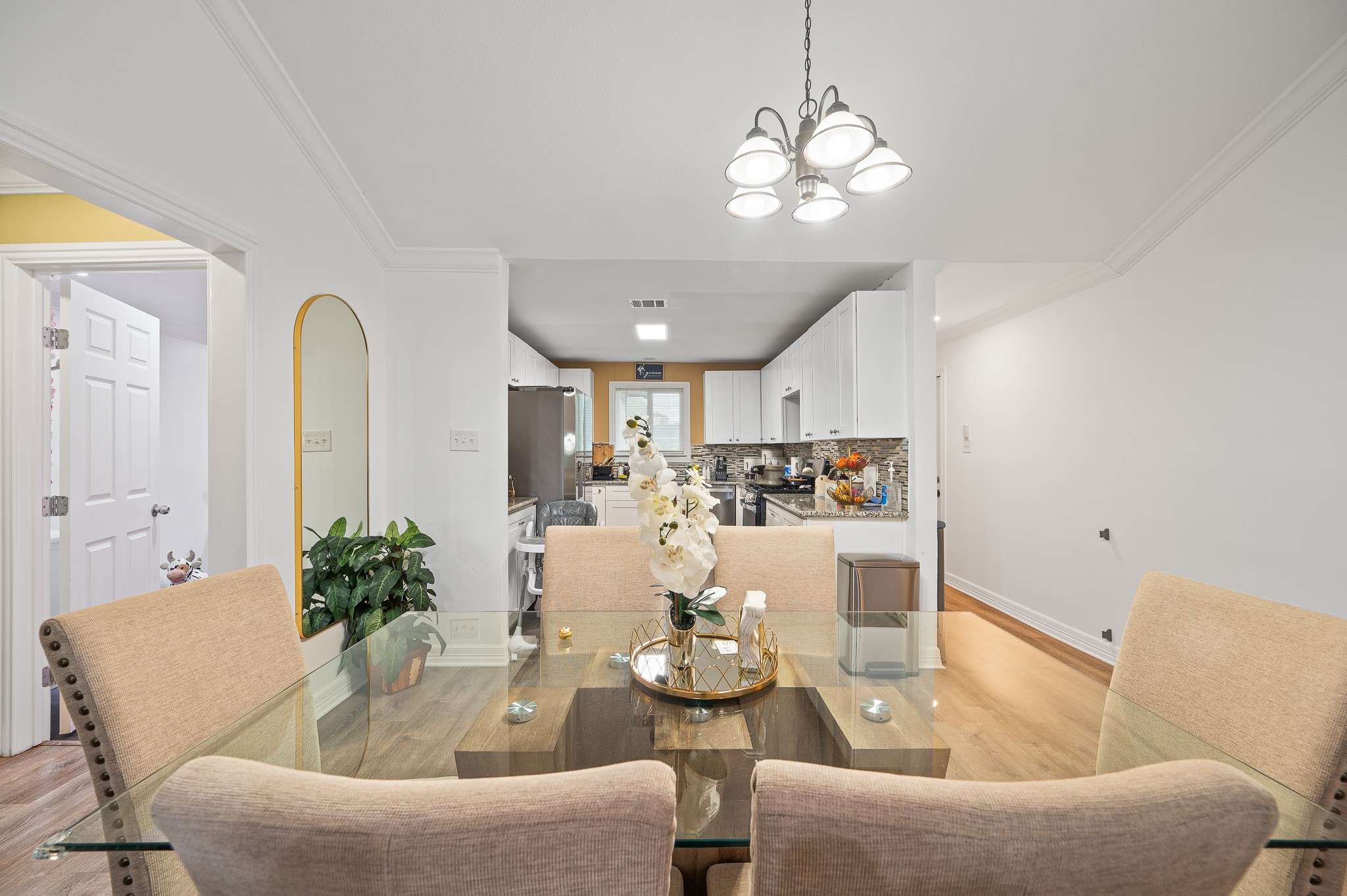 3823 Shadow Trail Houston, TX 77084 - Photo 8 of 29 a view of a dining room with furniture and chandelier