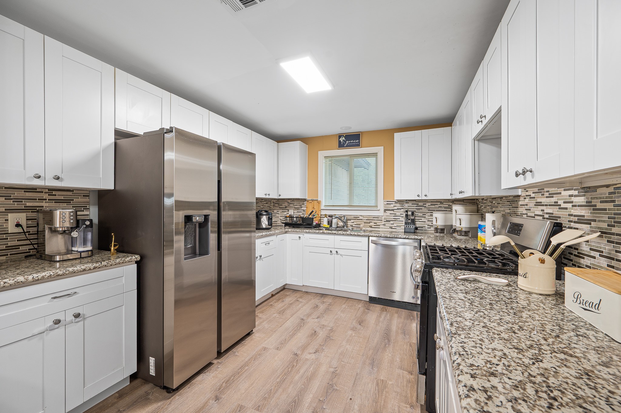 3823 Shadow Trail Houston, TX 77084 - Photo 9 of 29 a kitchen with stainless steel appliances granite countertop a refrigerator sink and cabinets