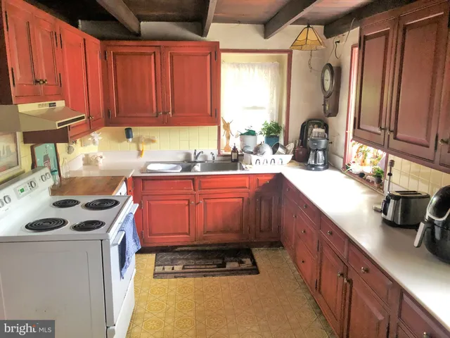 a room with furniture and a flat tv screen