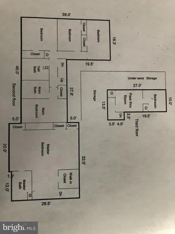 a bedroom with a bed and a mirror