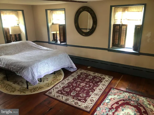 a view of a dining room with furniture and window