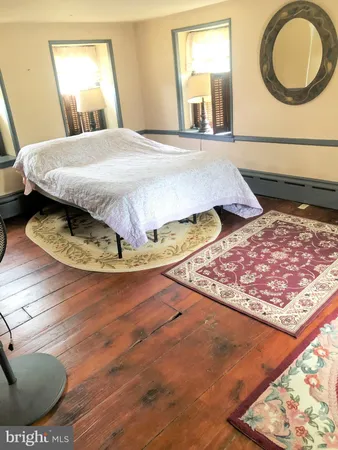 a view of living room with furniture and a fireplace