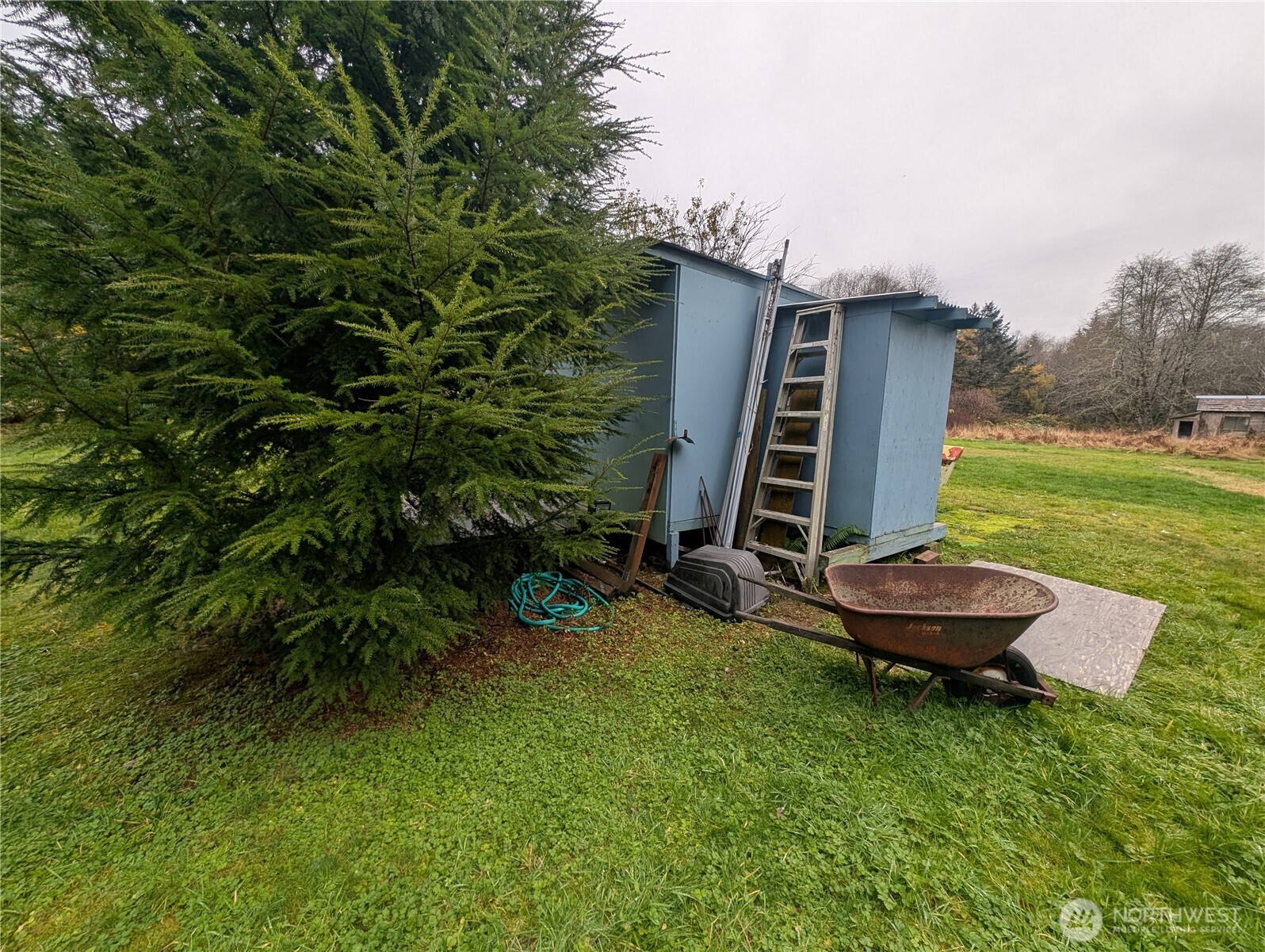 81 Barber Road Clallam Bay, WA 98326 - Photo 22 of 30 a front view of a house with garden