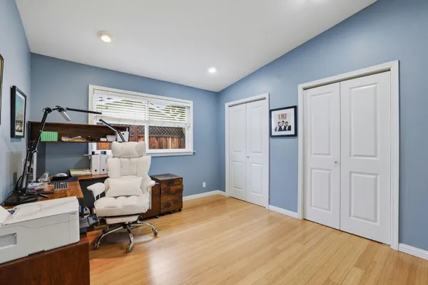 a workspace with furniture and a window