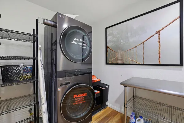 a view of a bedroom with washer and dryer