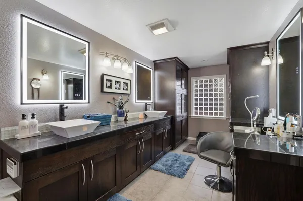 a bathroom with a sink double vanity and a mirror