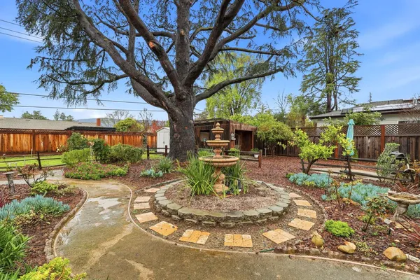 a view of a bench in a backyard