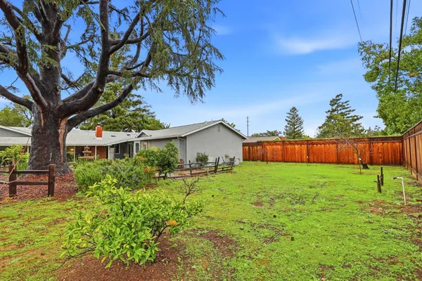 an aerial view of a house with a garden