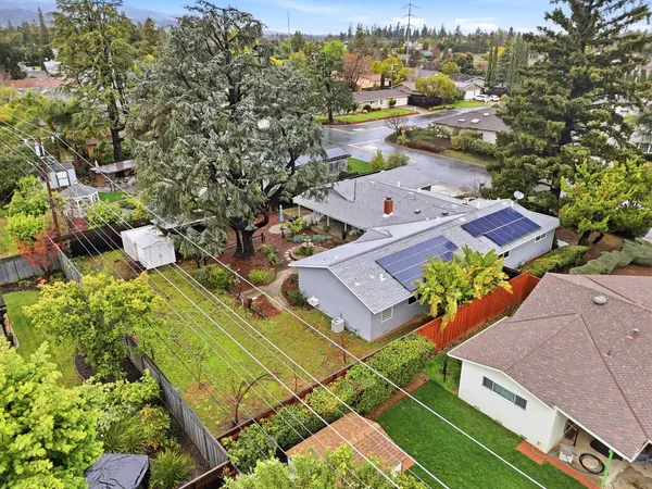 an aerial view of residential houses with outdoor space