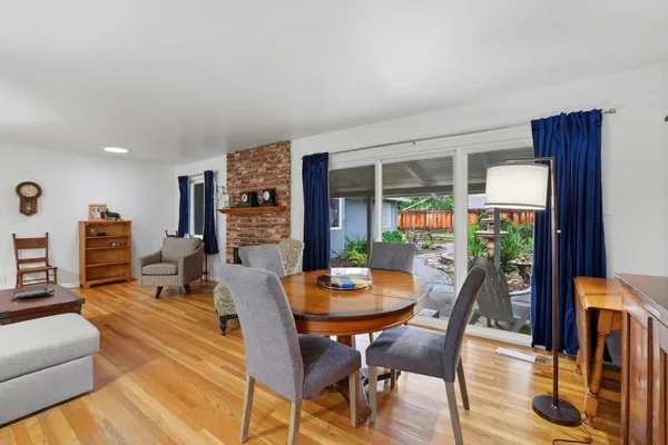 a view of a dining room with furniture window and outside view