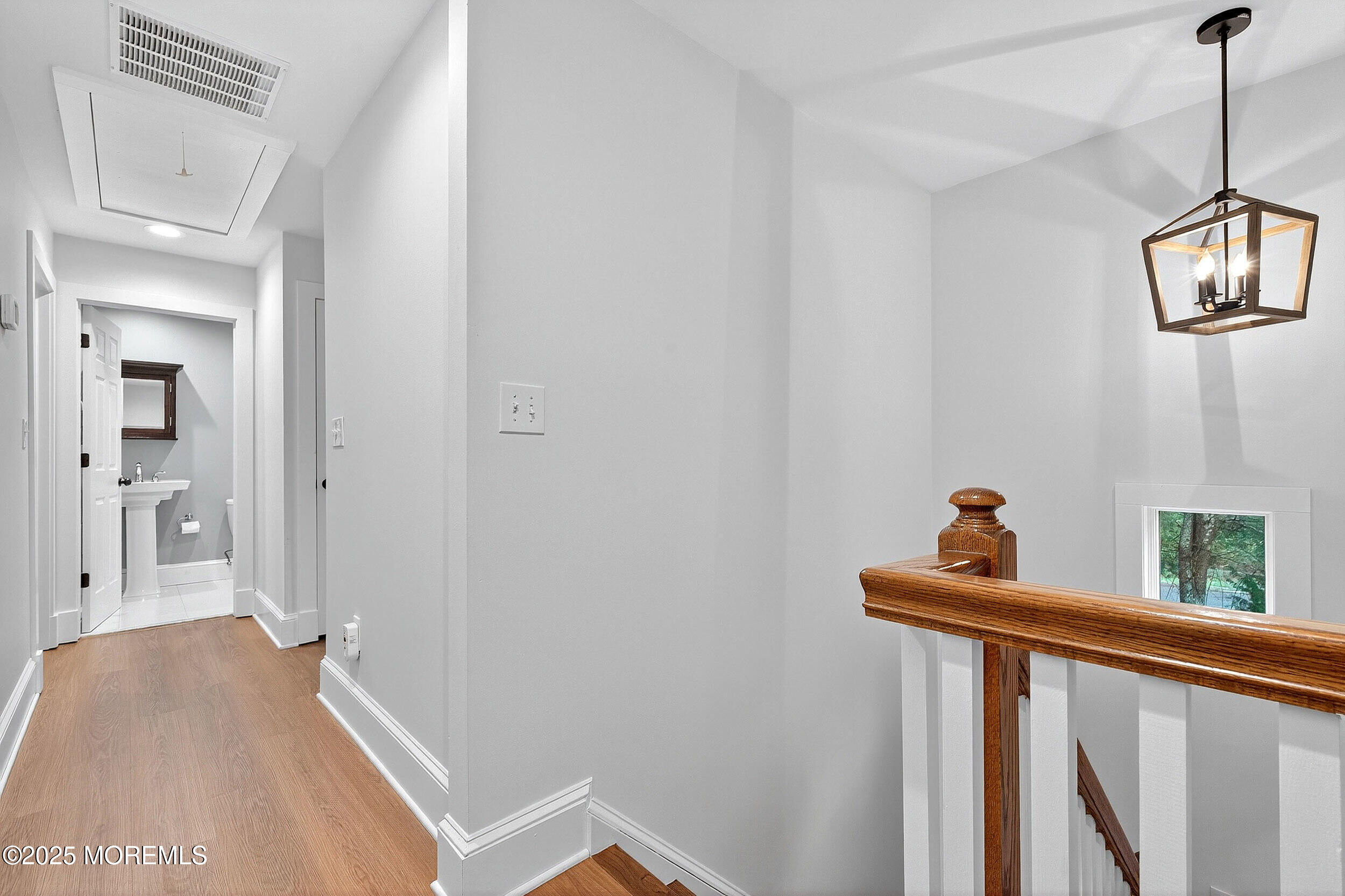 1961 Jumping Brook Road Tinton Falls, NJ 07753 - Photo 17 of 45 a view of a hallway to a livingroom with furniture